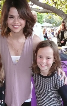 Lexi with Selena Gomez at charity event